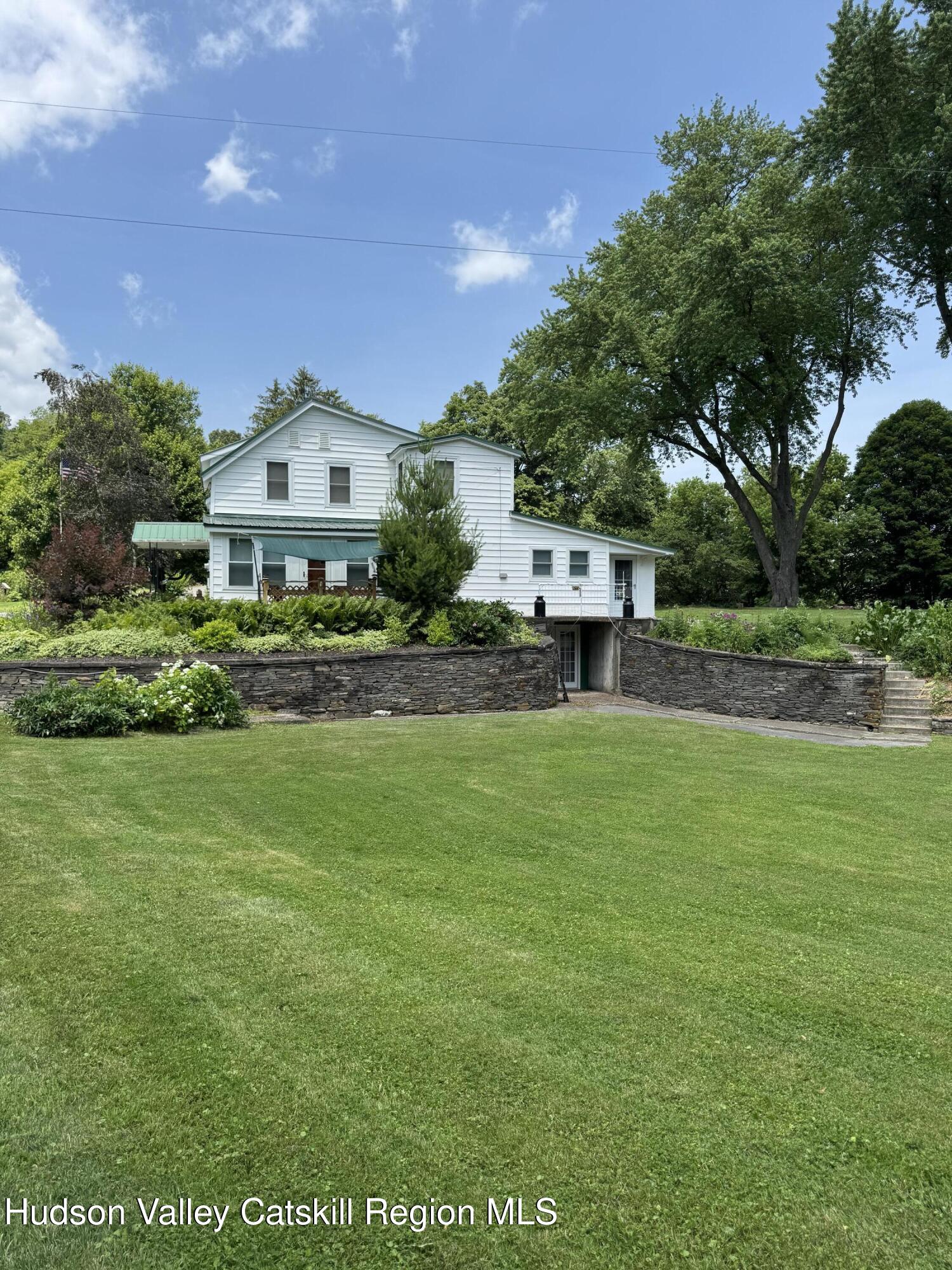 189-195 Vedder Road Catskill, NY 12414 - Photo 2 of 39 a front view of a house with a yard