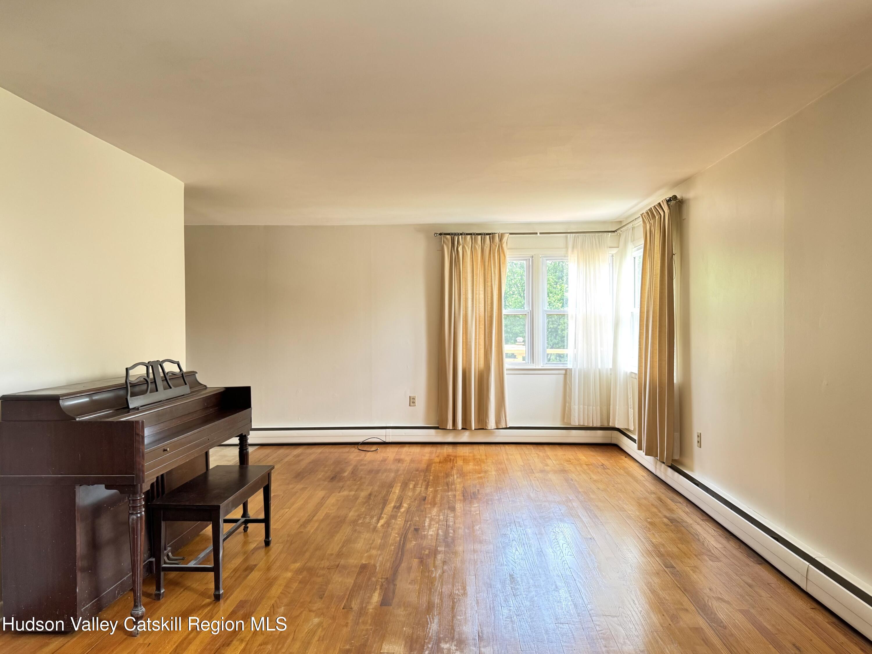 189-195 Vedder Road Catskill, NY 12414 - Photo 25 of 39 a view of a room with wooden floor and a window