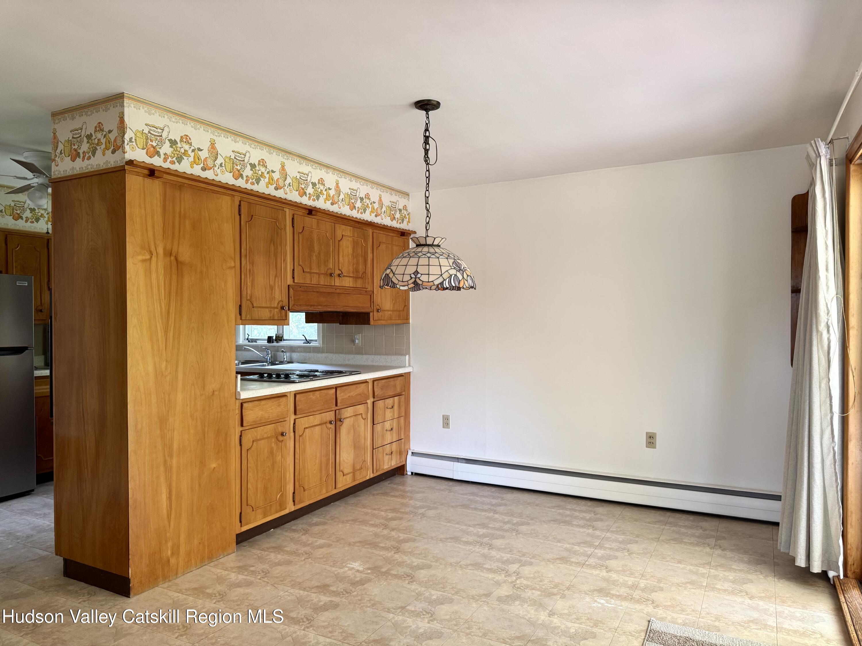 189-195 Vedder Road Catskill, NY 12414 - Photo 27 of 39 a kitchen with granite countertop cabinets and appliances