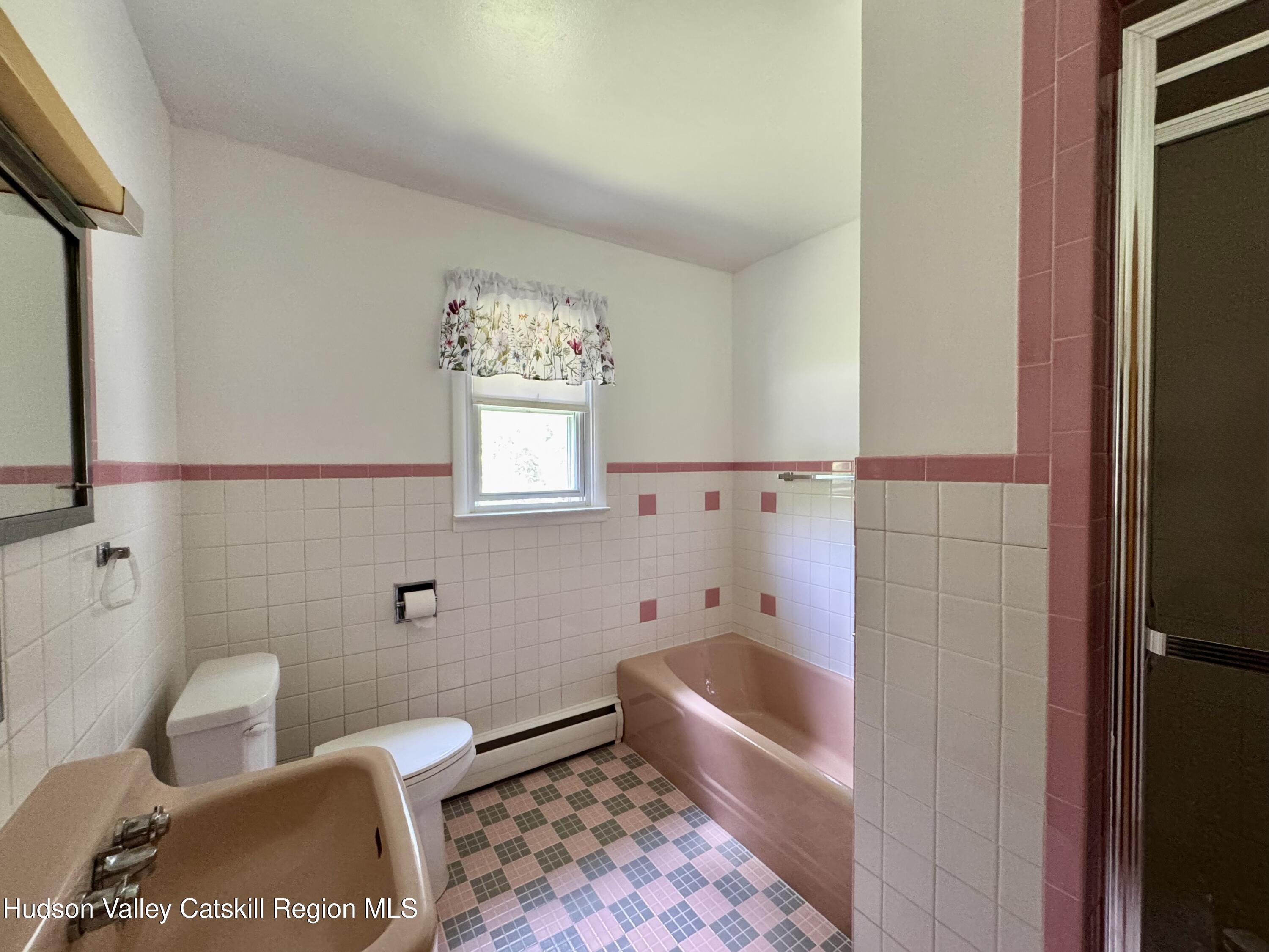 189-195 Vedder Road Catskill, NY 12414 - Photo 33 of 39 a bathroom with a tub toilet and sink