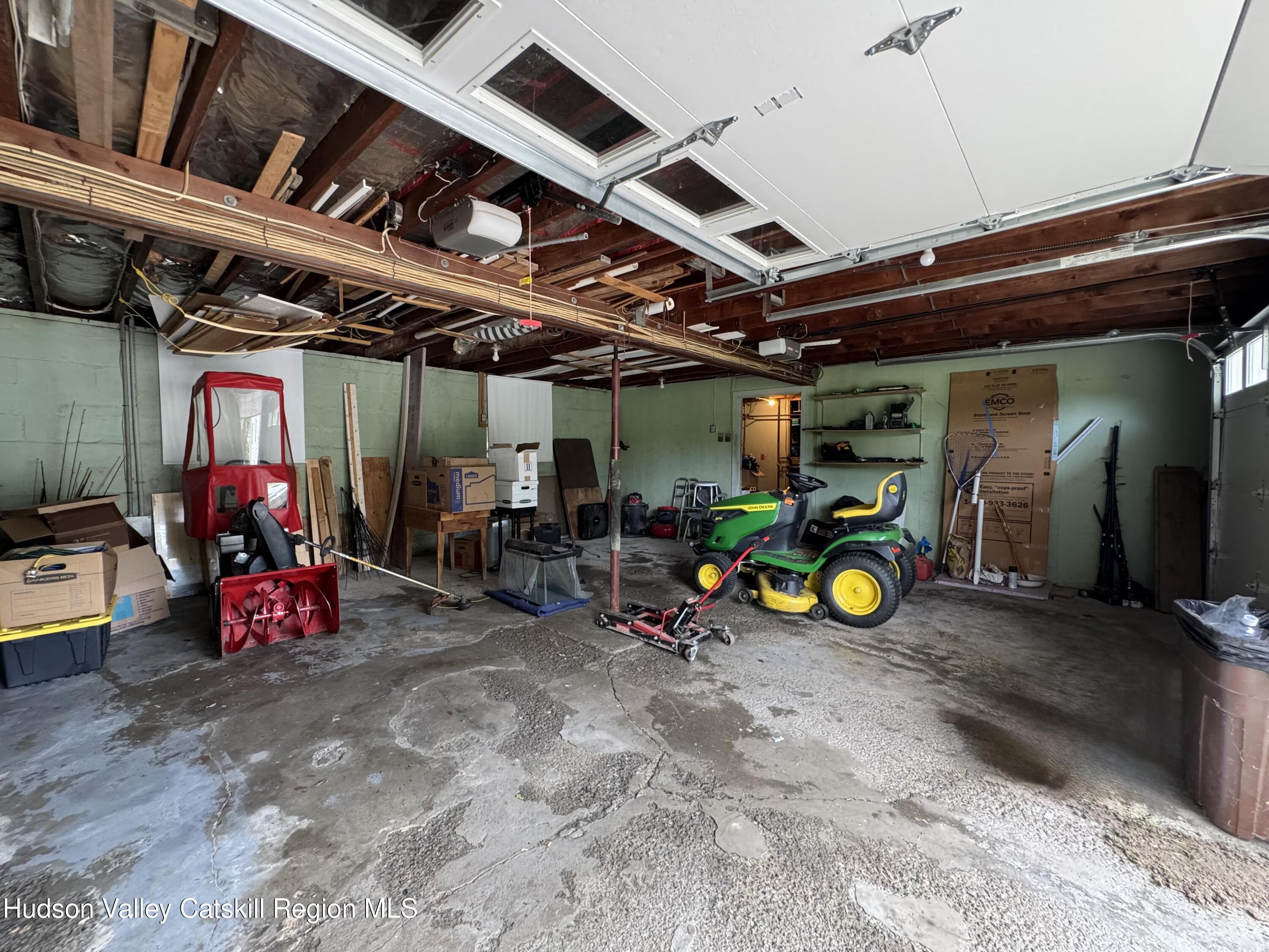 189-195 Vedder Road Catskill, NY 12414 - Photo 36 of 39 a view of a garage with a bike and a car