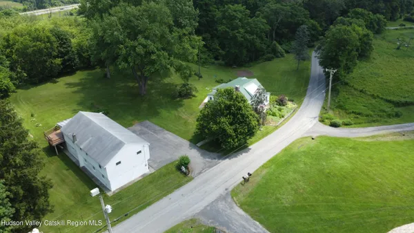 an aerial view of a house having yard