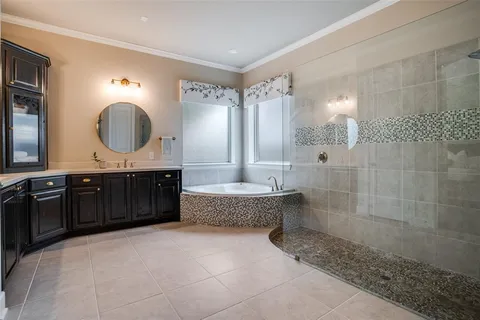 a bathroom with a granite countertop sink a mirror and a shower