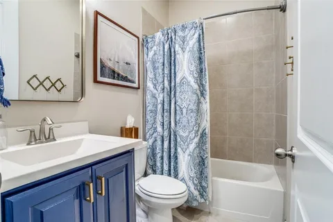 a bathroom with a sink a toilet and a bathtub