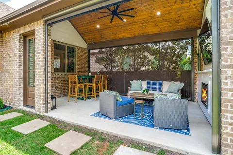 a view of a patio with couches chairs and a table and chairs