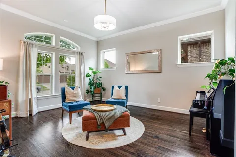 a living room with furniture rug and window