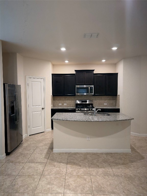 369 Shale Circle Buda, TX 78610 - Photo 3 of 15 a view of kitchen with stainless steel appliances wooden floor and living room view