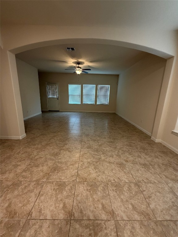 369 Shale Circle Buda, TX 78610 - Photo 4 of 15 a view of an empty room with window and chandelier fan