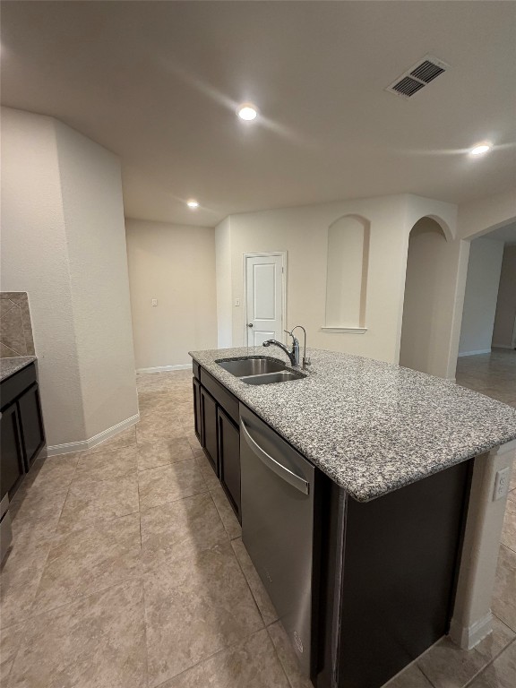369 Shale Circle Buda, TX 78610 - Photo 6 of 15 a kitchen with a sink a counter top space and cabinets