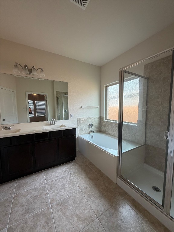 369 Shale Circle Buda, TX 78610 - Photo 8 of 15 a spacious bathroom with a bathtub sink and mirror