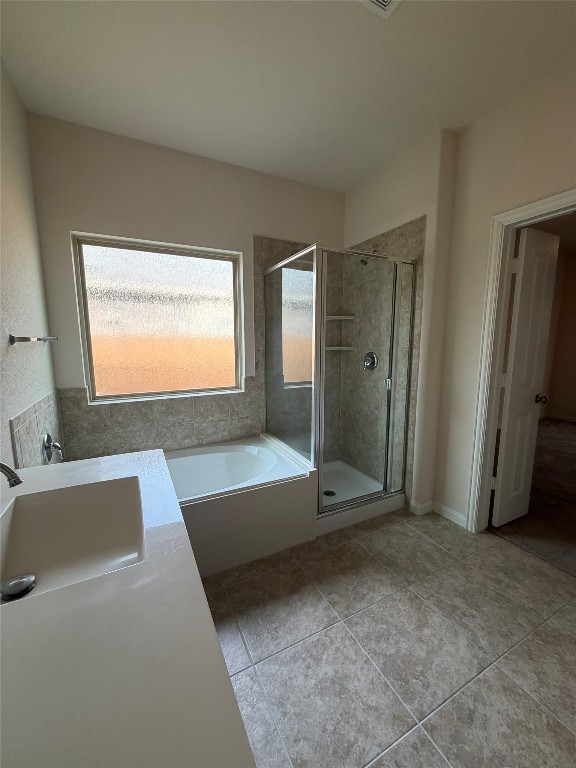 369 Shale Circle Buda, TX 78610 - Photo 10 of 15 a bathroom with a tub sink and mirror