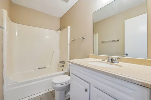 a bathroom with a sink a toilet and a bathtub