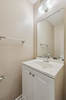 a bathroom with a sink and vanity