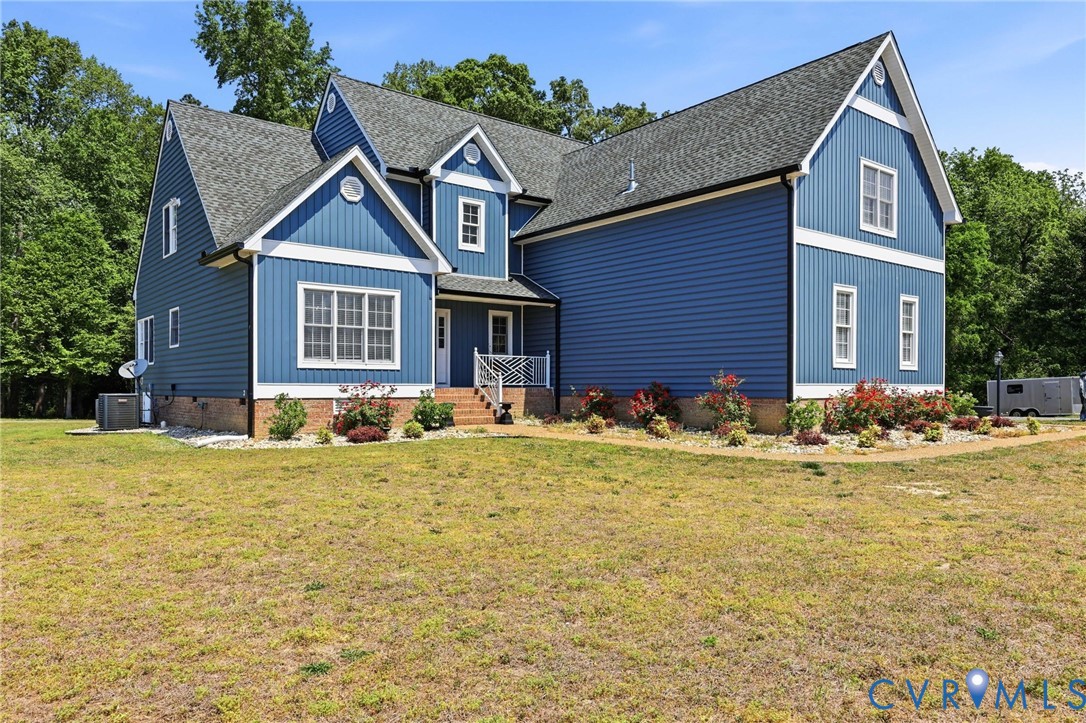 2018 Old Church Road Mechanicsville, VA 23111 - Photo 2 of 49 a front view of a house with garden