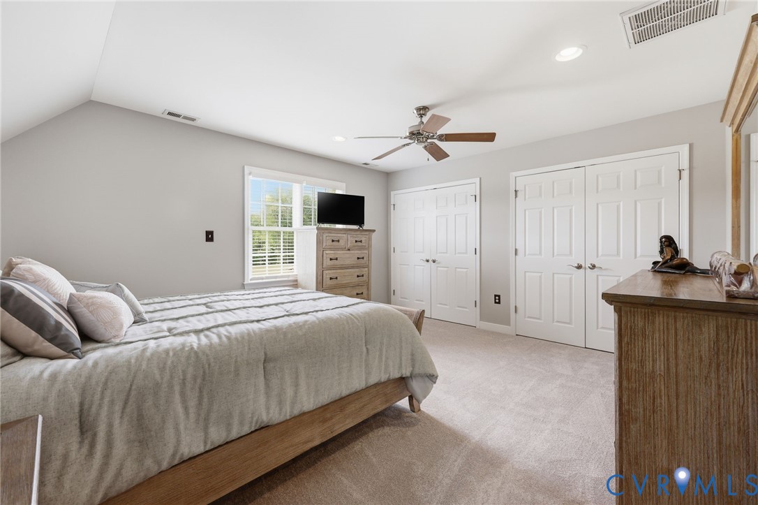 2018 Old Church Road Mechanicsville, VA 23111 - Photo 34 of 49 a bedroom with a large bed a flat tv screen and dresser