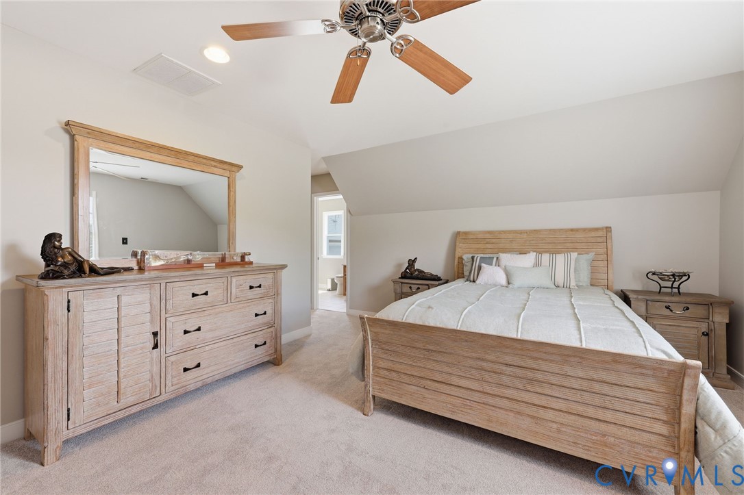 2018 Old Church Road Mechanicsville, VA 23111 - Photo 35 of 49 a bedroom with a bed and a mirror on the dresser