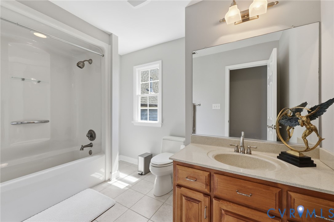 2018 Old Church Road Mechanicsville, VA 23111 - Photo 36 of 49 a bathroom with a sink double vanity granite tub shower and a mirror