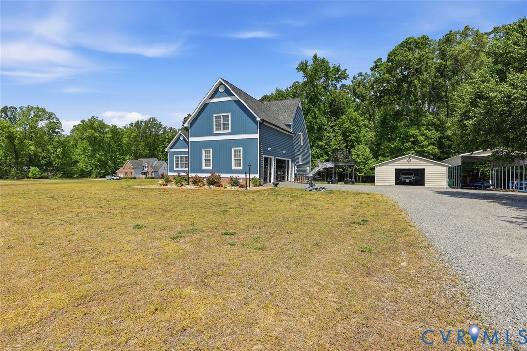 2018 Old Church Road Mechanicsville, VA 23111 - Photo 4 of 49 a front view of a house with a yard
