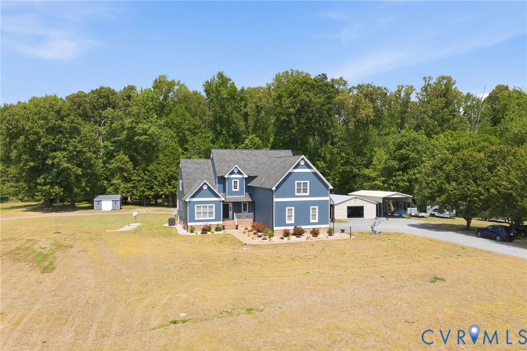 2018 Old Church Road Mechanicsville, VA 23111 - Photo 41 of 49 a house with trees in front of it