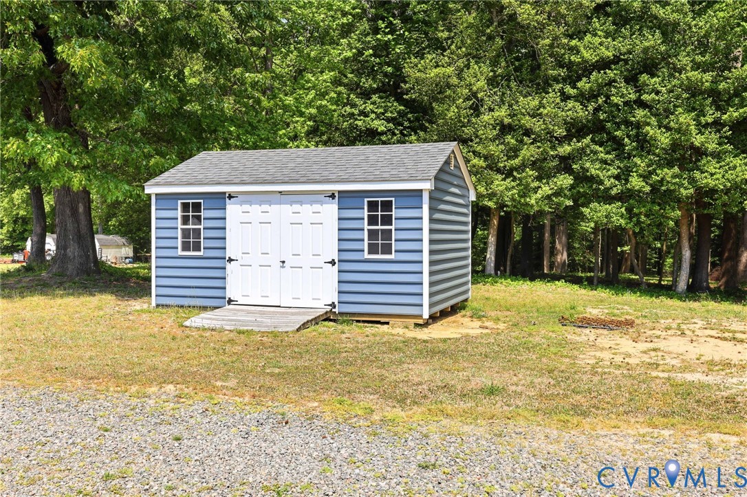 2018 Old Church Road Mechanicsville, VA 23111 - Photo 43 of 49 a view of a house with a yard and garage