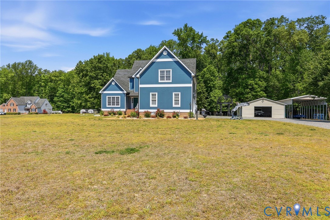 2018 Old Church Road Mechanicsville, VA 23111 - Photo 5 of 49 a front view of a house with a yard