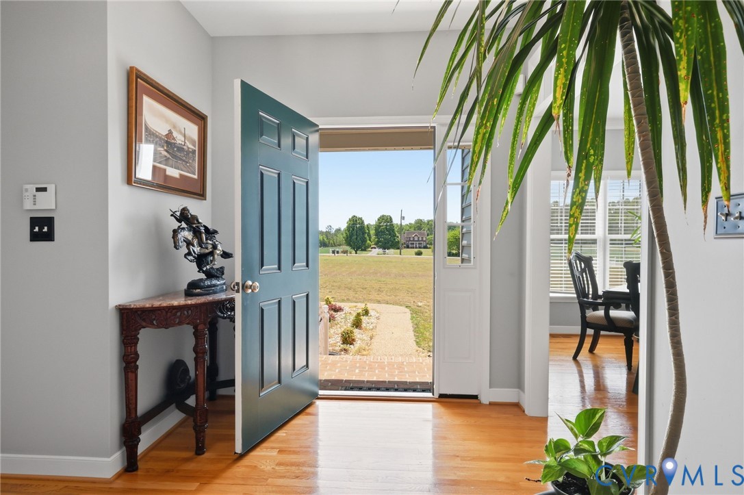 2018 Old Church Road Mechanicsville, VA 23111 - Photo 9 of 49 a view of a hallway with furniture and a floor to ceiling window