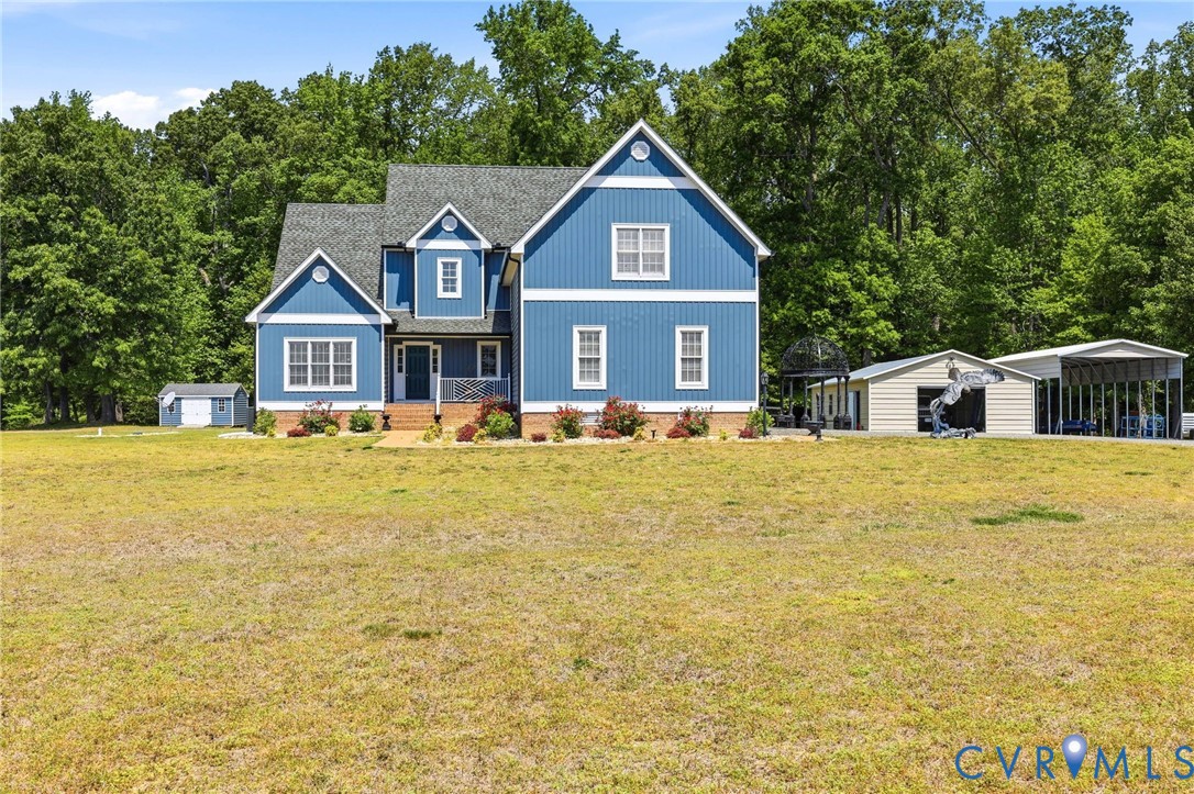 2018 Old Church Road Mechanicsville, VA 23111 - Photo 10 of 49 a front view of a house with a yard