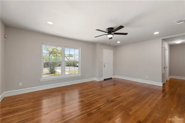 a view of an empty room with a window