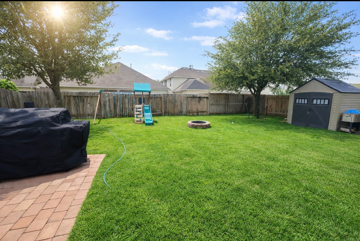 3015 Cimarron Pass Drive Spring, TX 77373 - Photo 11 of 11 a view of a backyard with a garden and trees
