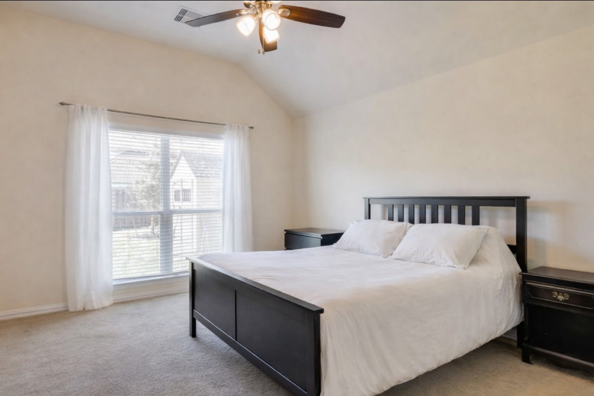 3015 Cimarron Pass Drive Spring, TX 77373 - Photo 5 of 11 a large bed sitting in a bedroom next to a window