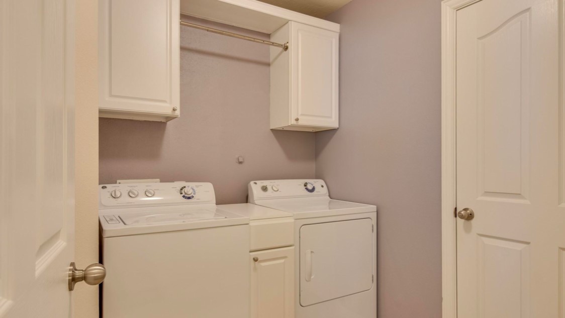3015 Cimarron Pass Drive Spring, TX 77373 - Photo 10 of 11 a utility room with dryer and washer