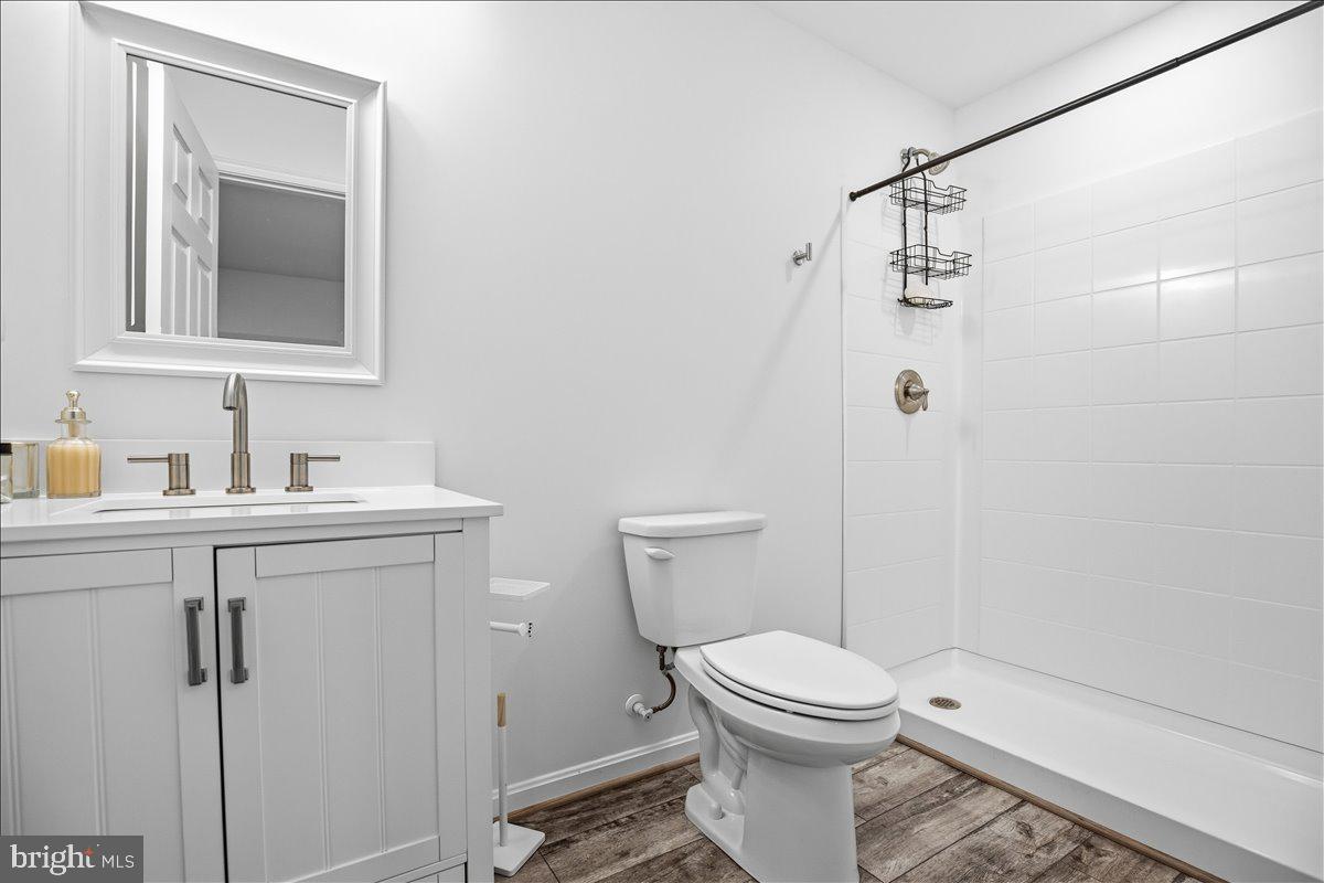16146 Thomas Road Piney Point, MD 20674 - Photo 64 of 70 a bathroom with a toilet sink and shower