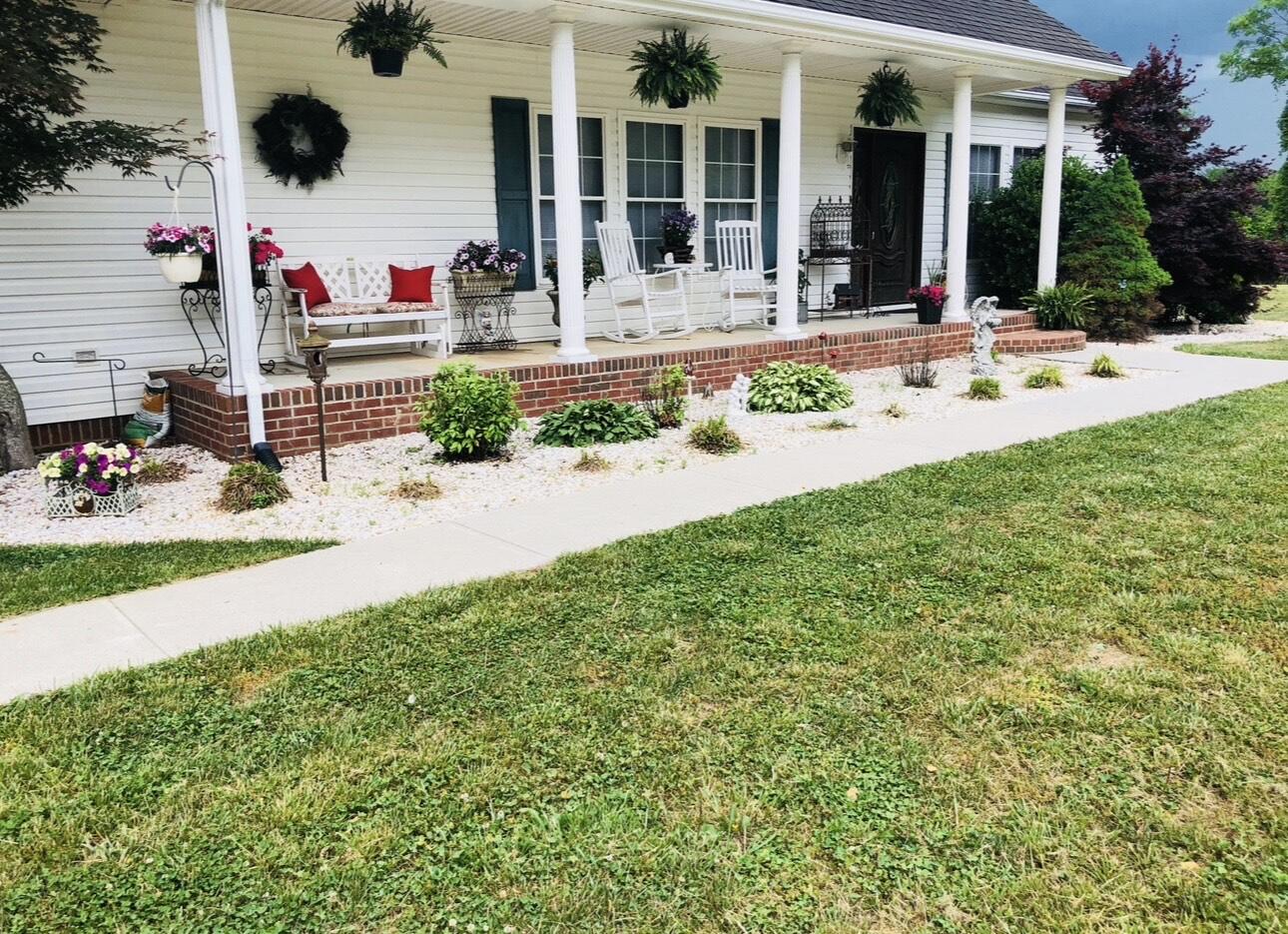 80 Bonbrook Road Wirtz, VA 24184 - Photo 14 of 53 front view of house with a yard and potted plants