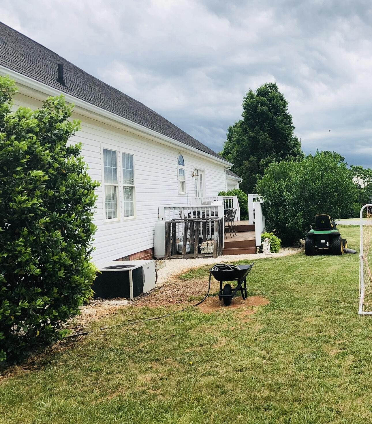 80 Bonbrook Road Wirtz, VA 24184 - Photo 15 of 53 a view of a house with backyard and a tree