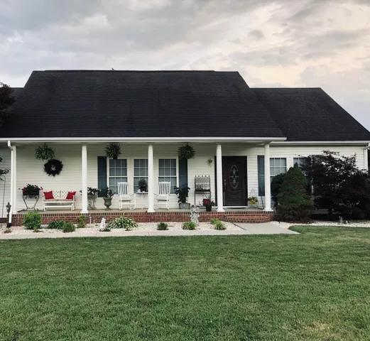 front view of a house with a yard