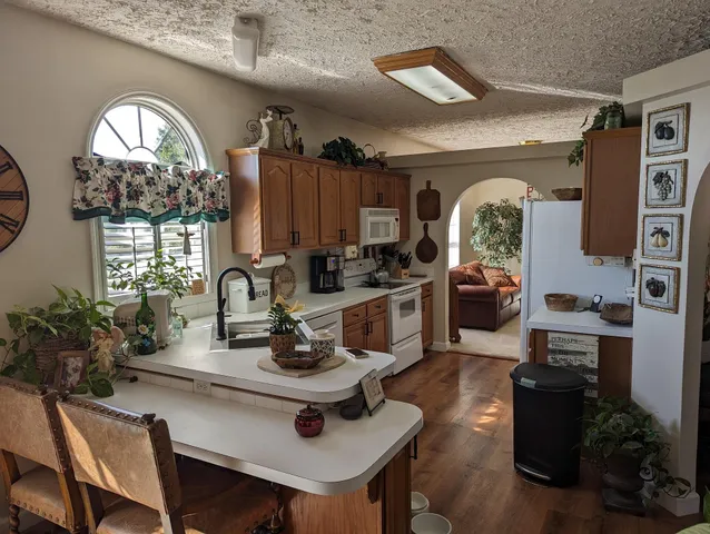a view of a kitchen area with furniture and window