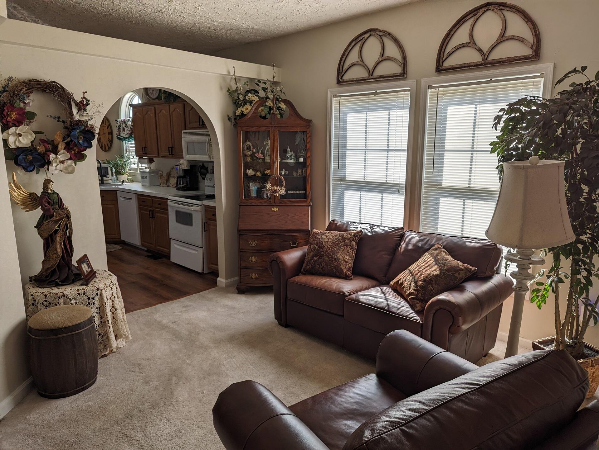 80 Bonbrook Road Wirtz, VA 24184 - Photo 35 of 53 a living room with furniture a flat screen tv and a floor to ceiling window