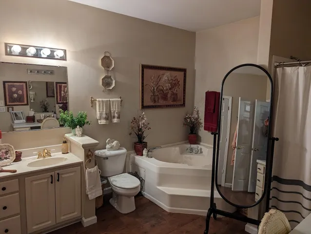 a view of a livingroom with furniture and bathroom