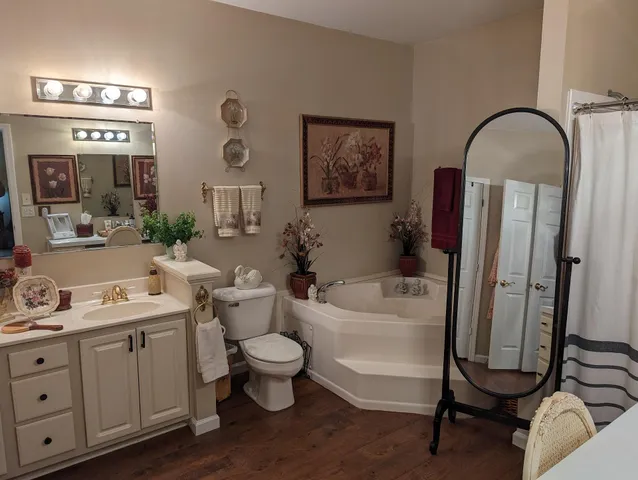 a living room with furniture and a mirror