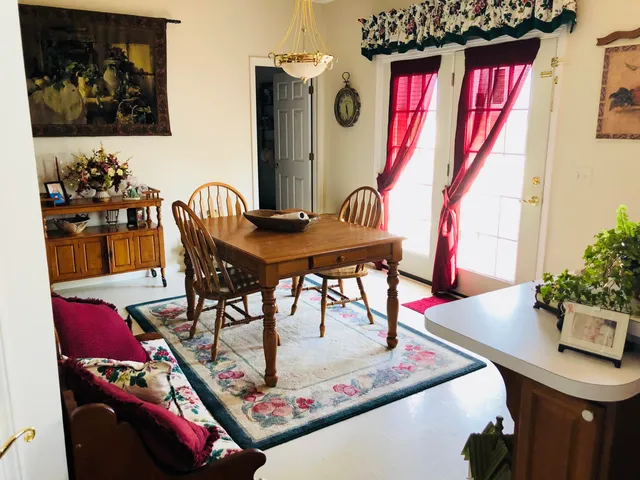a view of a dining room with furniture and a couch