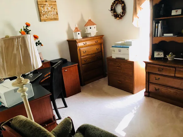 a bed room with a bed and furniture