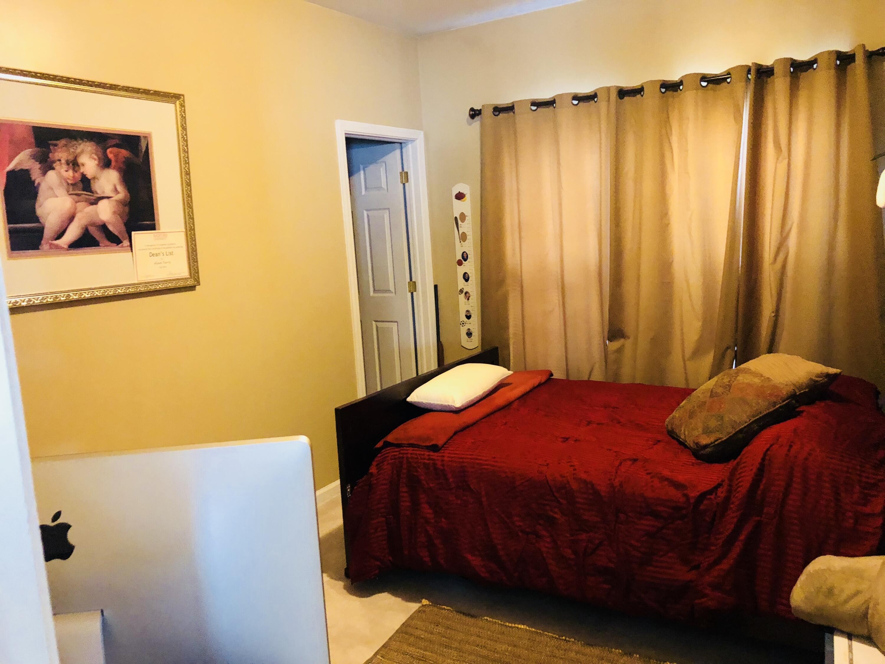 80 Bonbrook Road Wirtz, VA 24184 - Photo 10 of 53 a bedroom with a bed and a wall painting