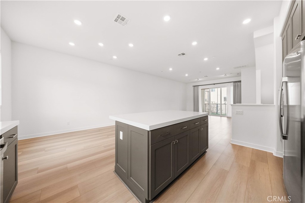 312 Tank Irvine, CA 92618 - Photo 15 of 68 a kitchen with a sink and a wooden floor