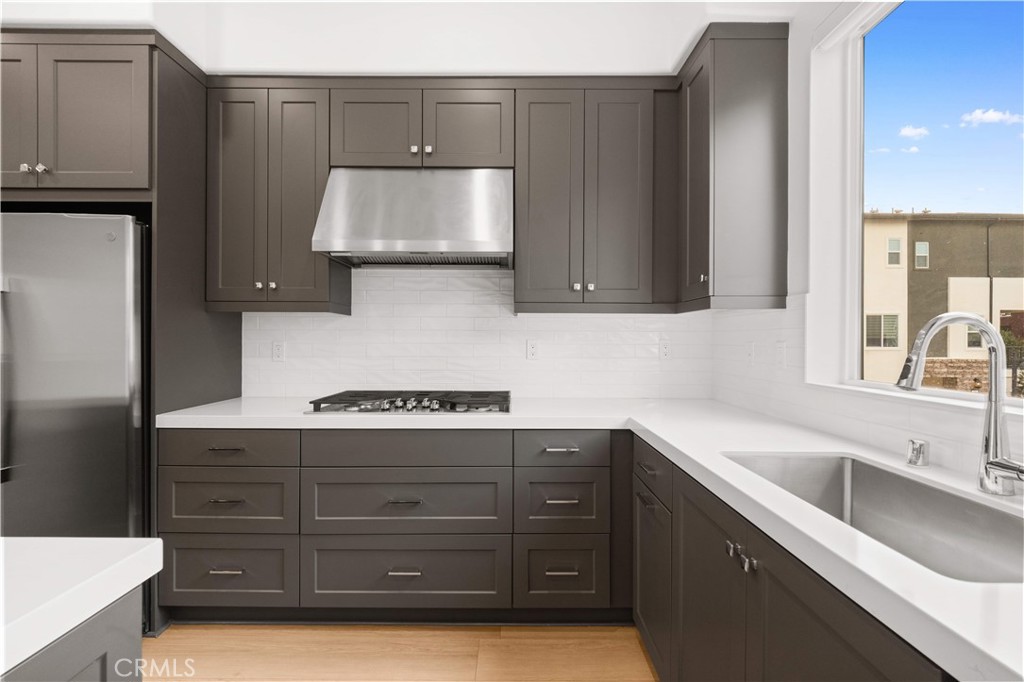 312 Tank Irvine, CA 92618 - Photo 17 of 68 a kitchen with a sink a stove and cabinets