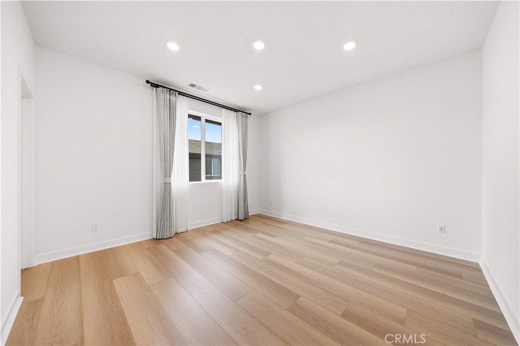 312 Tank Irvine, CA 92618 - Photo 29 of 68 a view of an empty room with wooden floor and a window