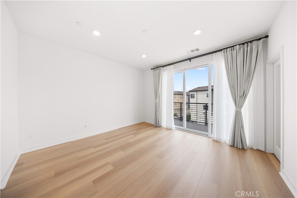 312 Tank Irvine, CA 92618 - Photo 34 of 68 a view of empty room with wooden floor and fan