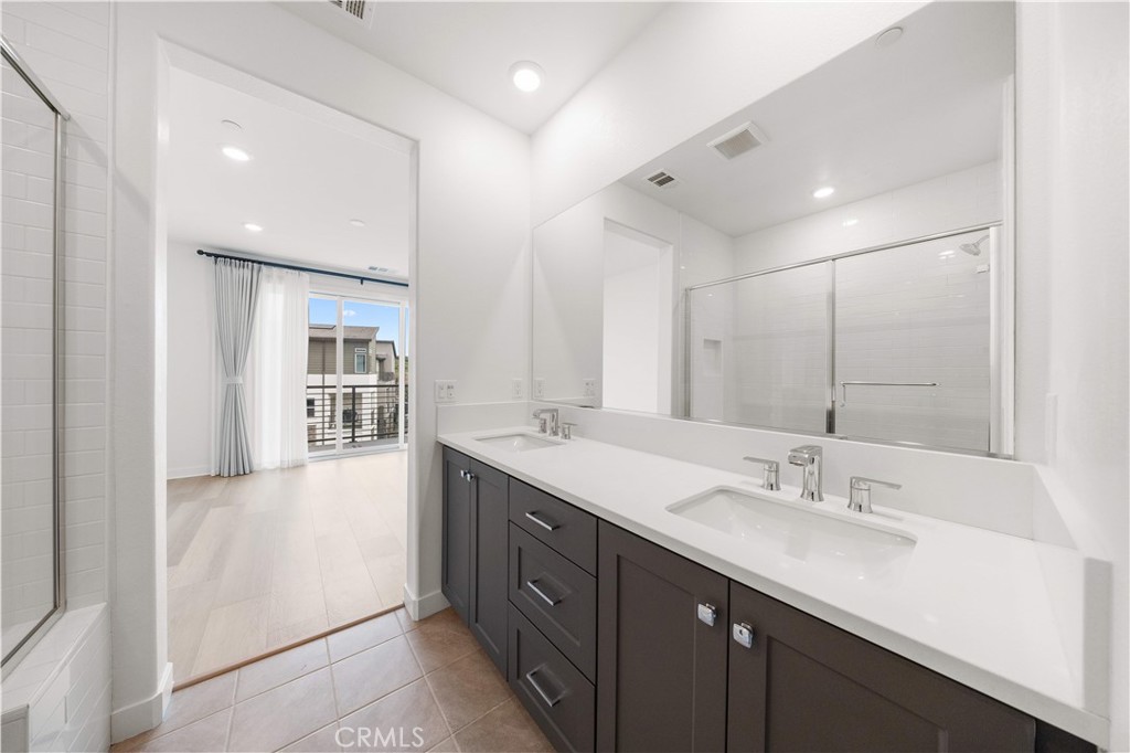 312 Tank Irvine, CA 92618 - Photo 37 of 68 a spacious bathroom with a double vanity sink and mirror