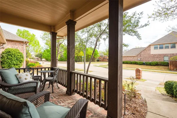 a view of a patio with couches chairs dining table and chairs barbeque grill with a small yard