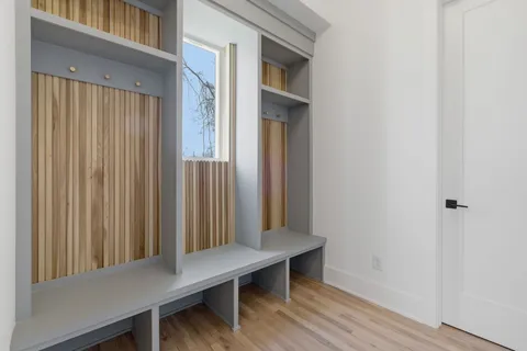a view of walk in closet with empty racks