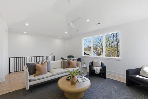 a spacious bathroom with 2 sink and a mirror